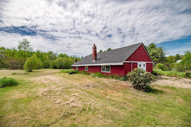 14 Porter St, Searsport, ME 04974 - view of side of property featuring a chimney, a yard, an outbuilding, and roof with shingles