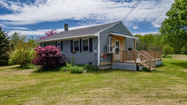 14 Porter St, Searsport, ME 04974 - view of front facade featuring a chimney, a front lawn, and cooling unit