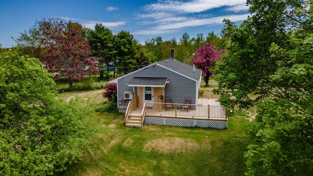 14 Porter St, Searsport, ME 04974 - rear view of property with a yard, a deck, roof with shingles, and a cooling unit