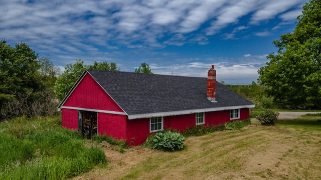 14 Porter St, Searsport, ME 04974 - view of side of property featuring a chimney, a shingled roof, and a lawn