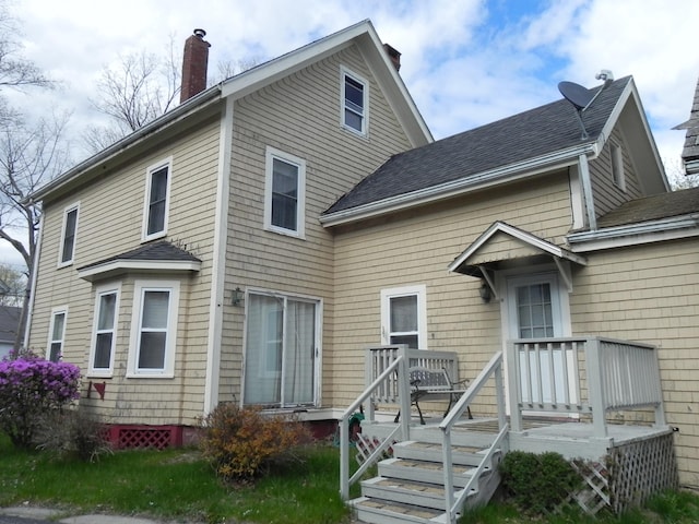 back of house featuring a deck