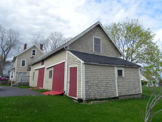 view of property exterior featuring a yard