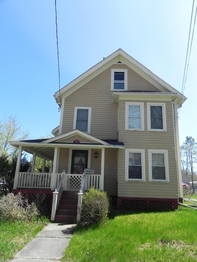 view of front facade featuring a front yard and a porch