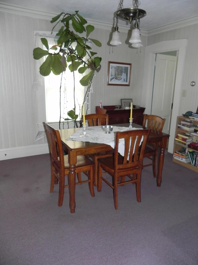 dining area with carpet flooring and ornamental molding