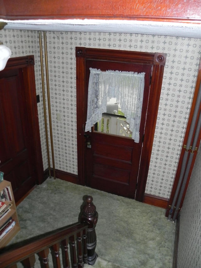 view of carpeted entrance foyer