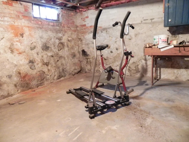 workout room featuring concrete floors