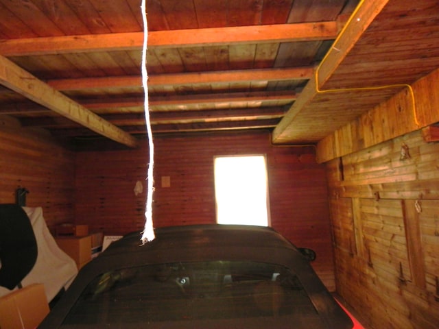 garage with wooden walls and wooden ceiling