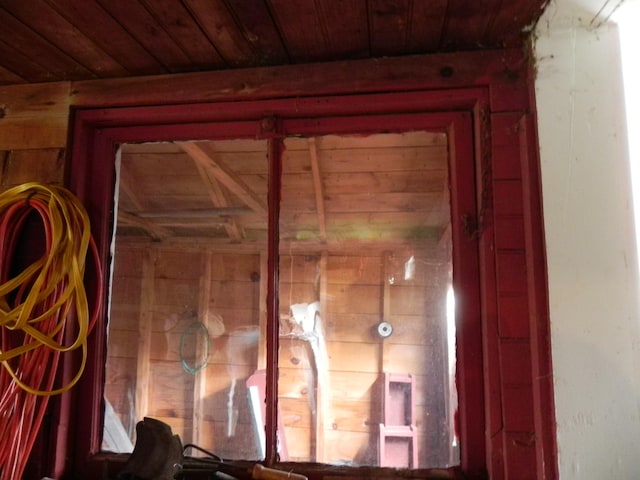 interior details with wood walls and wood ceiling