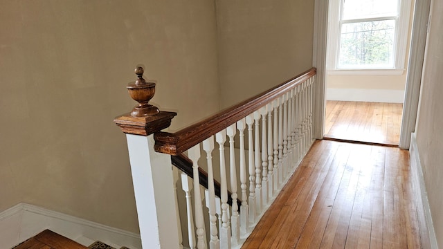 stairway featuring hardwood / wood-style floors