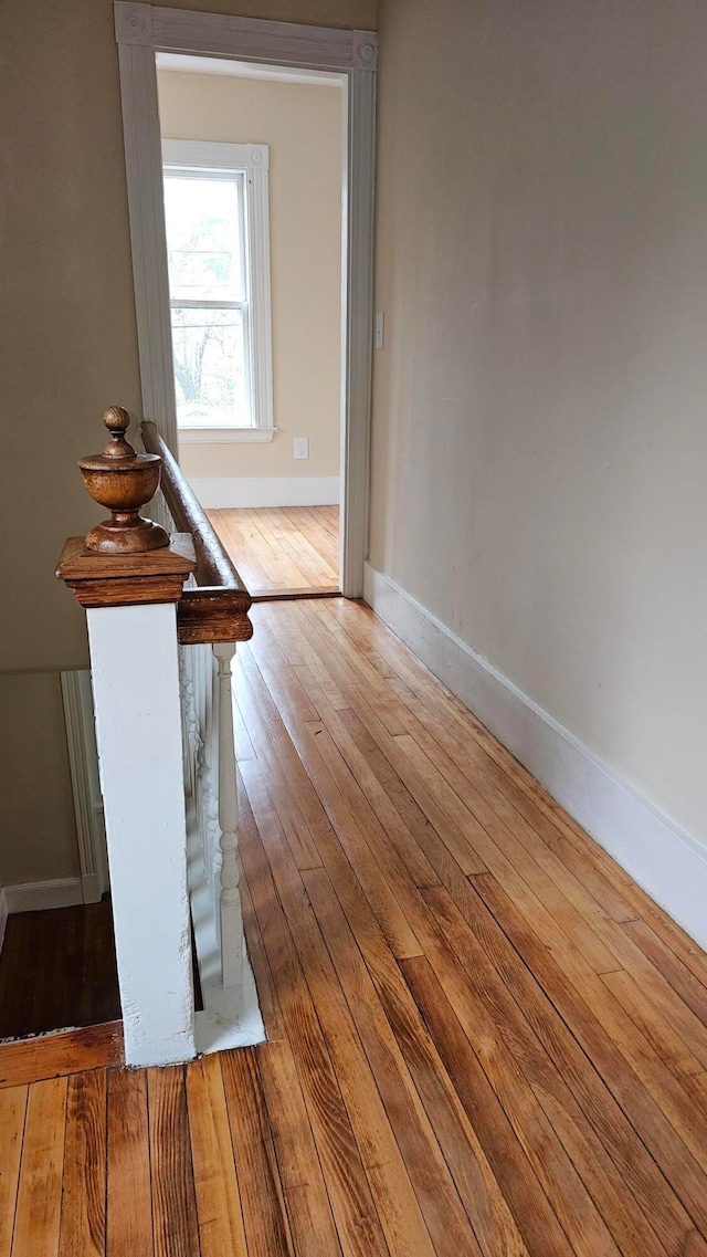 corridor featuring hardwood / wood-style floors