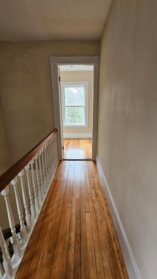 corridor with light wood-type flooring