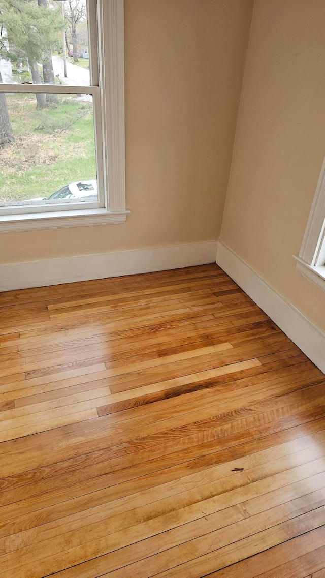 spare room featuring light wood-type flooring