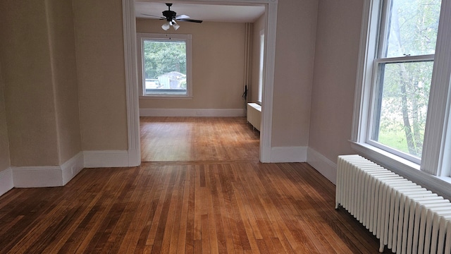 interior space featuring radiator and dark hardwood / wood-style floors