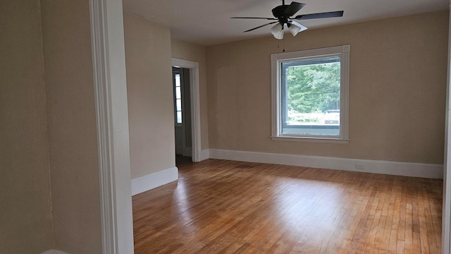 spare room with wood-type flooring and ceiling fan