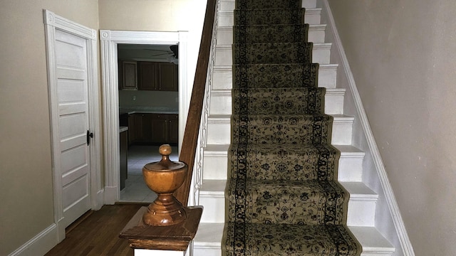 staircase featuring hardwood / wood-style flooring