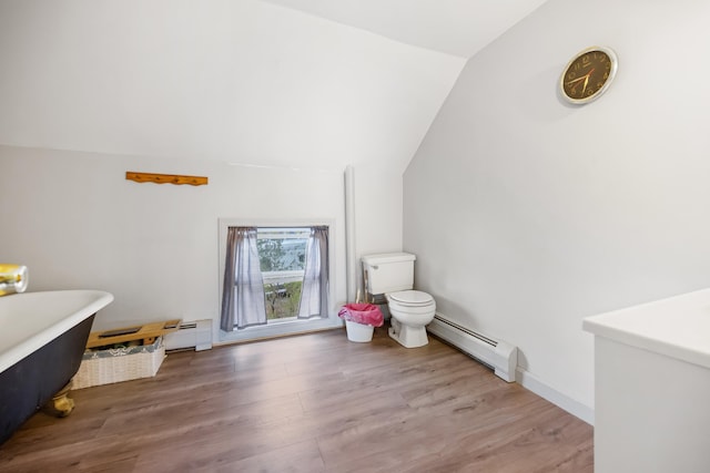 bathroom with lofted ceiling, hardwood / wood-style flooring, baseboard heating, and toilet