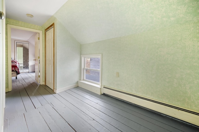 bonus room with hardwood / wood-style floors, lofted ceiling, and a baseboard radiator