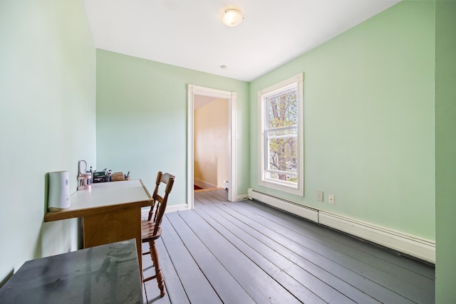 dining room featuring hardwood / wood-style floors and a baseboard radiator