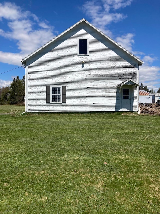 view of property exterior featuring a yard