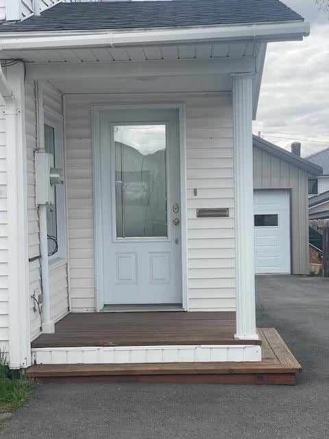 property entrance with a garage