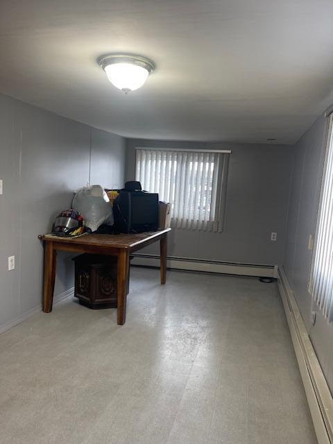 home office featuring a baseboard heating unit