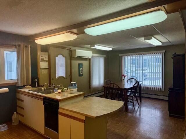 kitchen featuring sink, dishwasher, kitchen peninsula, a wall mounted AC, and dark parquet flooring