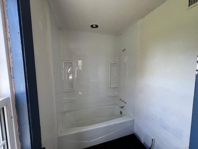 bathroom with bathing tub / shower combination