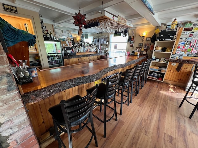 9 Tenney Hill Rd, Monson, ME 04464 - bar with beamed ceiling and hardwood / wood-style floors