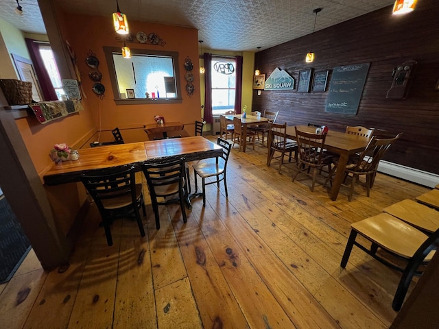 9 Tenney Hill Rd, Monson, ME 04464 - dining area with hardwood / wood-style floors and a baseboard radiator