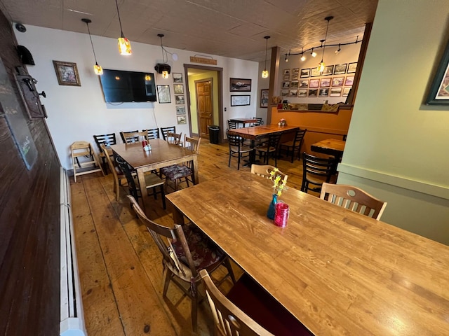 9 Tenney Hill Rd, Monson, ME 04464 - dining space with rail lighting and hardwood / wood-style floors