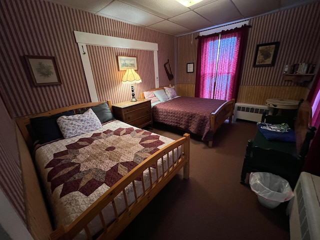 9 Tenney Hill Rd, Monson, ME 04464 - bedroom featuring a paneled ceiling, carpet floors, and radiator heating unit