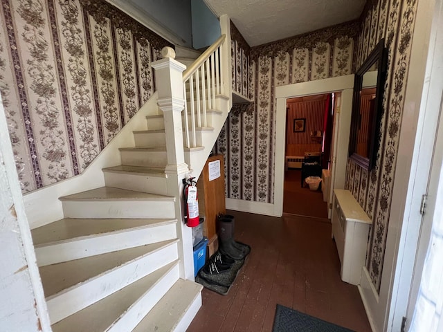9 Tenney Hill Rd, Monson, ME 04464 - stairway featuring dark hardwood / wood-style floors