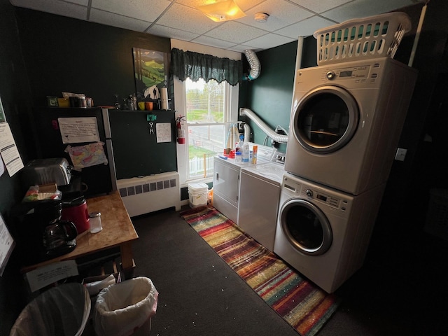 9 Tenney Hill Rd, Monson, ME 04464 - washroom featuring stacked washer / dryer, carpet, and radiator heating unit