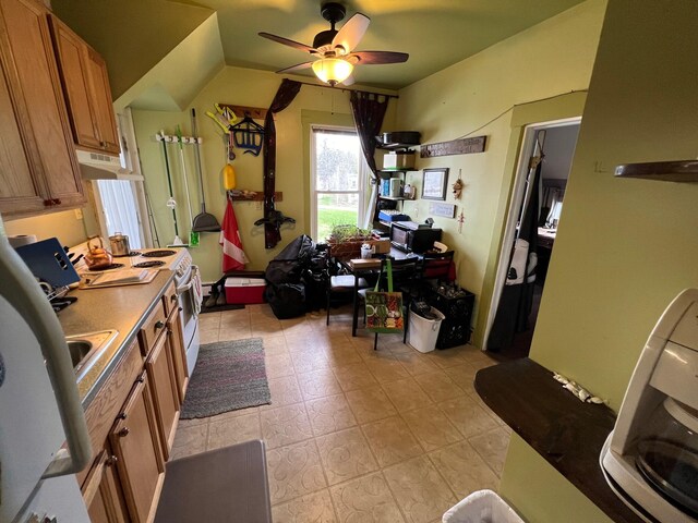 9 Tenney Hill Rd, Monson, ME 04464 - kitchen featuring white range with electric cooktop, light tile flooring, and ceiling fan