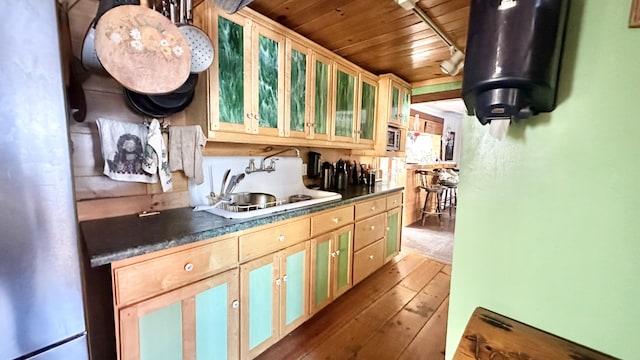 kitchen with stainless steel fridge, sink, wooden ceiling, and dark wood-type flooring