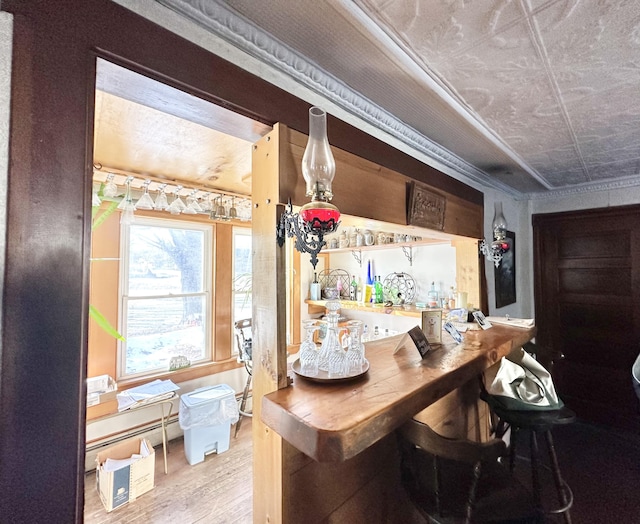 bar with hardwood / wood-style flooring