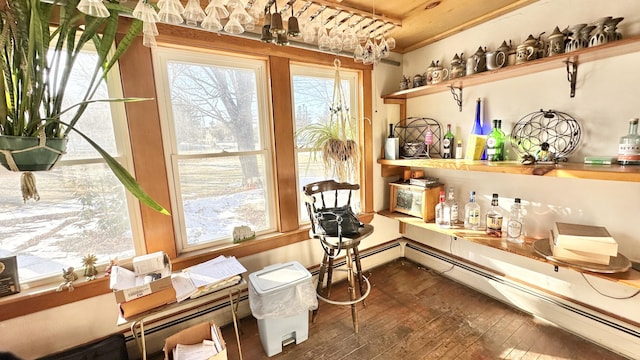 interior space with dark hardwood / wood-style floors and bar area