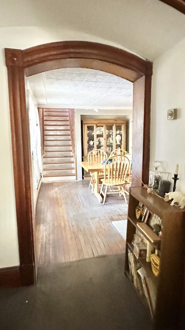 corridor with wood-type flooring