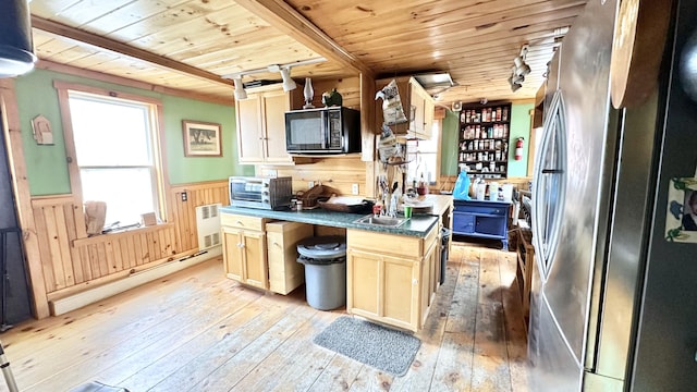 kitchen featuring stainless steel fridge, light hardwood / wood-style flooring, a kitchen island, and wood ceiling