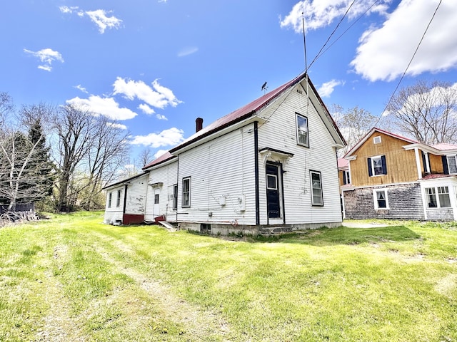 back of house with a yard