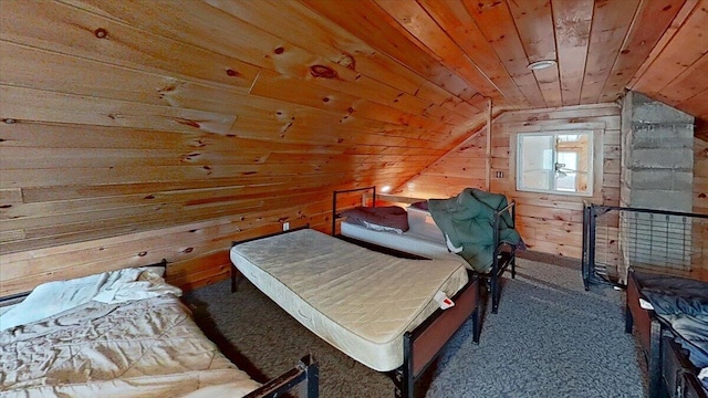 bedroom with wooden ceiling, wood walls, carpet floors, and lofted ceiling