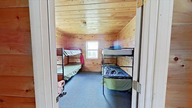 bedroom with wooden walls