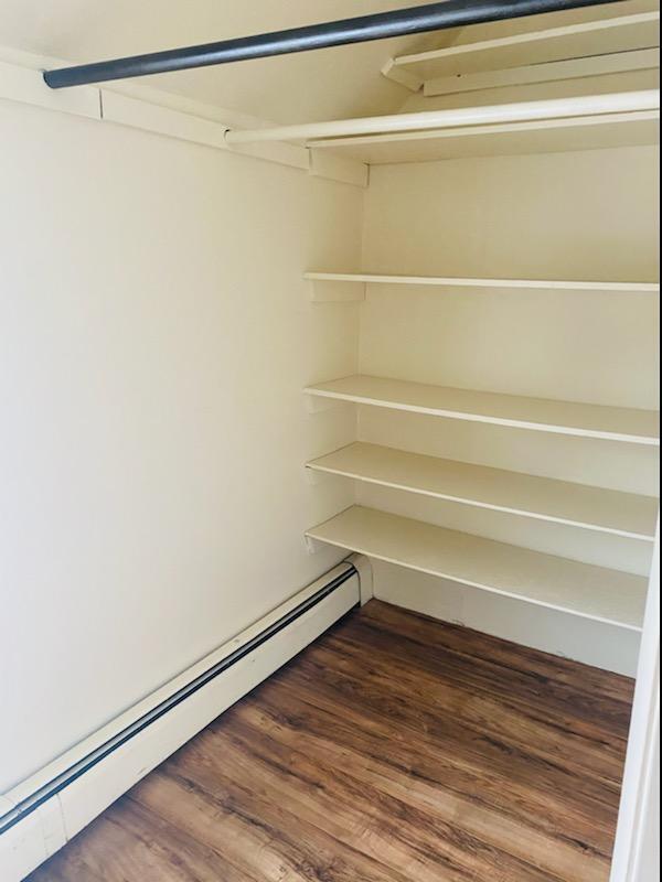 closet with a baseboard radiator