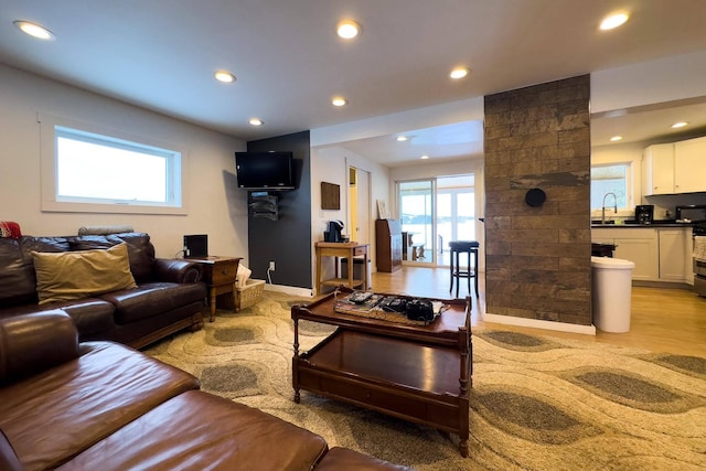 living room with a healthy amount of sunlight and light wood-type flooring