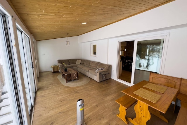 living room featuring wooden ceiling, lofted ceiling, and wood-type flooring