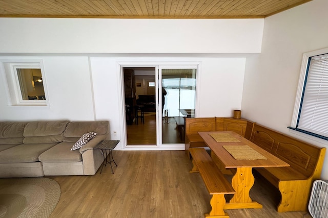 living room featuring wooden ceiling and hardwood / wood-style flooring