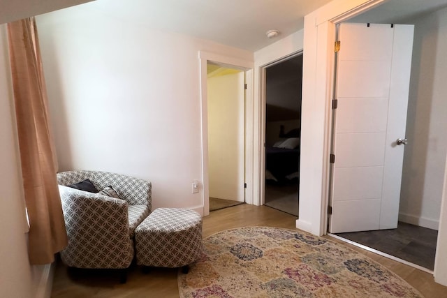 living area with hardwood / wood-style floors