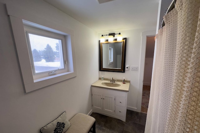 bathroom featuring vanity with extensive cabinet space and tile flooring