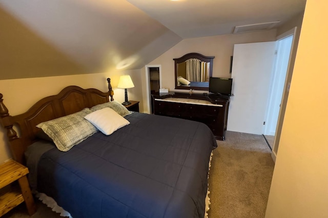 bedroom featuring carpet and lofted ceiling