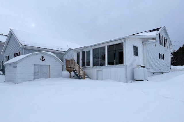 view of front of house featuring a shed